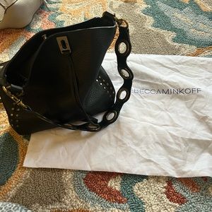 Black leather with gold hand ware.